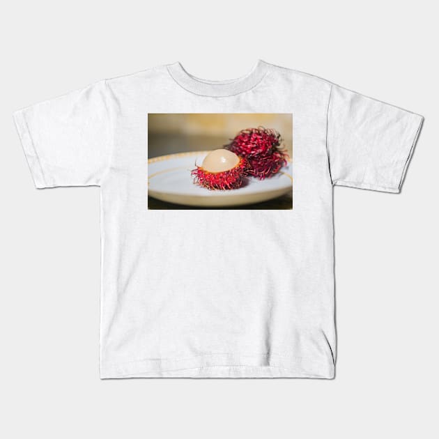 Rambutan cut in half Kids T-Shirt by KensLensDesigns